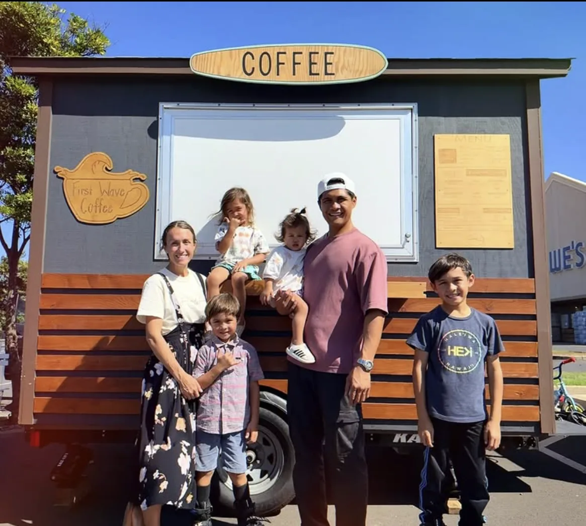 The First Wave Coffee family gathered in front of their coffee trailer on a sunny Kahului day.